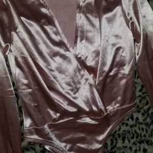 Brand new pantsuit with body suit top not as shiney as it looks but very sexy